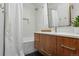 Modern bathroom with a walk-in shower, white subway tile, and a floating vanity at 3069 S Detroit Way, Denver, CO 80210