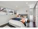 Bedroom with built-in desk and sliding door closet at 3069 S Detroit Way, Denver, CO 80210