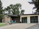 Mid-century modern home with attached two-car garage at 3069 S Detroit Way, Denver, CO 80210