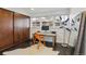 Bright home office featuring built-in wood closet and large window at 3069 S Detroit Way, Denver, CO 80210