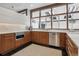 Modern kitchen with stainless steel appliances and wood cabinetry at 3069 S Detroit Way, Denver, CO 80210