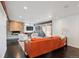 Living room features a leather couch and stone fireplace at 3069 S Detroit Way, Denver, CO 80210