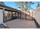 Private patio with brick pavers and modern wood fence at 3069 S Detroit Way, Denver, CO 80210