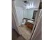 Bright bathroom with tile floor, modern vanity, and well-lit mirror creates a functional and inviting space at 4296 S Halifax Way, Aurora, CO 80013