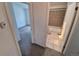 Cozy bathroom featuring a tiled shower and tub with a white toilet and tile flooring at 4296 S Halifax Way, Aurora, CO 80013