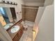 Functional bathroom with a full shower and tub, vanity, and good natural light at 4296 S Halifax Way, Aurora, CO 80013