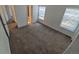 Bedroom featuring plush carpeting, bright windows, and ample closet space for comfortable living at 4296 S Halifax Way, Aurora, CO 80013