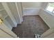 Neutral bedroom featuring plush carpeting, a bright window, and ample closet space for comfortable living at 4296 S Halifax Way, Aurora, CO 80013