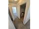 Hallway featuring access to a powder room with tiled flooring and oak vanity at 4296 S Halifax Way, Aurora, CO 80013