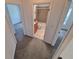 Hallway that provides entrance to two bedrooms and the bathroom at 4296 S Halifax Way, Aurora, CO 80013