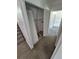 Hallway features closet with louvered doors and access to laundry and bathrooms at 4296 S Halifax Way, Aurora, CO 80013