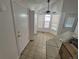 Bright eat-in kitchen featuring tile floors, bay window, and modern ceiling fan at 4296 S Halifax Way, Aurora, CO 80013