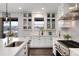 Spacious kitchen with white cabinets, stainless steel appliances, and quartz countertops at 10841 Greycliffe Dr, Highlands Ranch, CO 80126