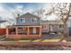 Home exterior showcasing a covered patio and spacious backyard at 2221 S Dearborn St, Aurora, CO 80014