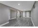 Finished basement with gray walls and vinyl plank flooring at 2221 S Dearborn St, Aurora, CO 80014