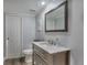 Basement bathroom with gray vanity and marble countertop at 2221 S Dearborn St, Aurora, CO 80014