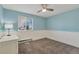 Light blue bedroom with ceiling fan and window at 2221 S Dearborn St, Aurora, CO 80014