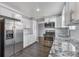 Modern kitchen with stainless steel appliances and granite countertops at 2221 S Dearborn St, Aurora, CO 80014