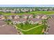 Aerial view of houses with lush green common areas and tree-lined streets at 22124 E Euclid Dr, Aurora, CO 80016