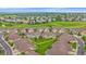 Scenic aerial view of a neighborhood with well-maintained homes next to a lush green golf course at 22124 E Euclid Dr, Aurora, CO 80016