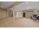 Spacious basement featuring neutral carpeting, recessed lighting, and built-in shelving at 22124 E Euclid Dr, Aurora, CO 80016