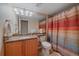 Bathroom with granite countertops, a vanity with lighting, and a shower-tub combination at 22124 E Euclid Dr, Aurora, CO 80016