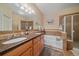 Bathroom features double sinks, tile floors, a large soaking tub, and a separate glass-enclosed shower at 22124 E Euclid Dr, Aurora, CO 80016