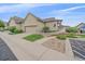 Charming home featuring an attached two-car garage, attractive landscaping, and accessible ramp for easy entry at 22124 E Euclid Dr, Aurora, CO 80016