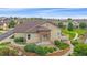 Inviting single-story home with landscaped front yard and stone accents, offering accessibility with a convenient ramp at 22124 E Euclid Dr, Aurora, CO 80016