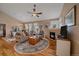 Inviting living area with a fireplace, vaulted ceilings, and a comfortable seating arrangement at 22124 E Euclid Dr, Aurora, CO 80016