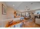 Cozy living room featuring hardwood floors, a fireplace, and a view of the adjacent dining area at 22124 E Euclid Dr, Aurora, CO 80016