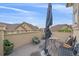 Outdoor patio features a partial view, a table and chairs, and green scenery in the distance at 22124 E Euclid Dr, Aurora, CO 80016