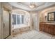 Spa-like bathroom with a large soaking tub and walk-in shower at 6386 E Tufts Ave, Englewood, CO 80111