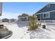 Snowy backyard with a small pine tree and wooden fence at 2058 Spencer Ave, Castle Rock, CO 80104