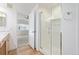 Bathroom featuring a glass enclosed shower, modern fixtures, white subway tile, and wood look flooring at 290 Poplar St # A, Denver, CO 80220