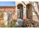 Charming entrance to this townhouse features brick accents, a covered entryway, and clear unit number signage at 290 Poplar St # A, Denver, CO 80220