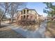 Exterior of this townhome has balconies, brick features and manicured landscaping for a well-maintained look and feel at 290 Poplar St # A, Denver, CO 80220