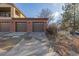 Brick two-car garage with driveway and adjacent landscaping at 290 Poplar St # A, Denver, CO 80220