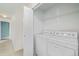 Convenient laundry room with a washer, dryer and storage shelves at 290 Poplar St # A, Denver, CO 80220