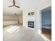 Bright living room featuring a fireplace and a view into another room at 290 Poplar St # A, Denver, CO 80220