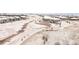 Aerial view of neighborhood with snowy paths, homes and creek in the background at 22364 E Bailey Pl, Aurora, CO 80016