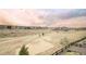 View of the backyard with a grassy area, fence, and surrounding neighborhood at 22364 E Bailey Pl, Aurora, CO 80016