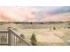 View of backyard with landscaping, fence, and neighboring houses in the distance at 22364 E Bailey Pl, Aurora, CO 80016