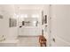 Modern bathroom featuring double vanity, large mirror, and frameless glass shower at 22364 E Bailey Pl, Aurora, CO 80016