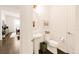 Half bathroom featuring a pedestal sink and toilet at 22364 E Bailey Pl, Aurora, CO 80016