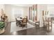 Stylish dining room with an elegant dining table and artwork, with a glimpse of the kitchen at 22364 E Bailey Pl, Aurora, CO 80016