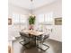 Bright dining room featuring a modern light fixture and large windows at 22364 E Bailey Pl, Aurora, CO 80016