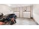 Spacious two-car garage featuring ample storage space and lighting at 22364 E Bailey Pl, Aurora, CO 80016