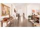 Hallway featuring dark wood floors, white walls, and modern decor at 22364 E Bailey Pl, Aurora, CO 80016