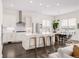 Open kitchen with stainless steel appliances, an island with bar stools, and a connected dining area at 22364 E Bailey Pl, Aurora, CO 80016